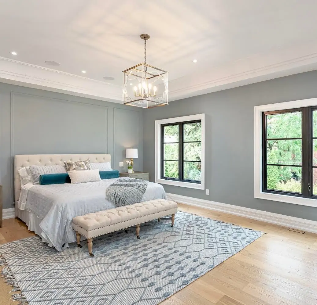 a bedroom with a bed and a bench